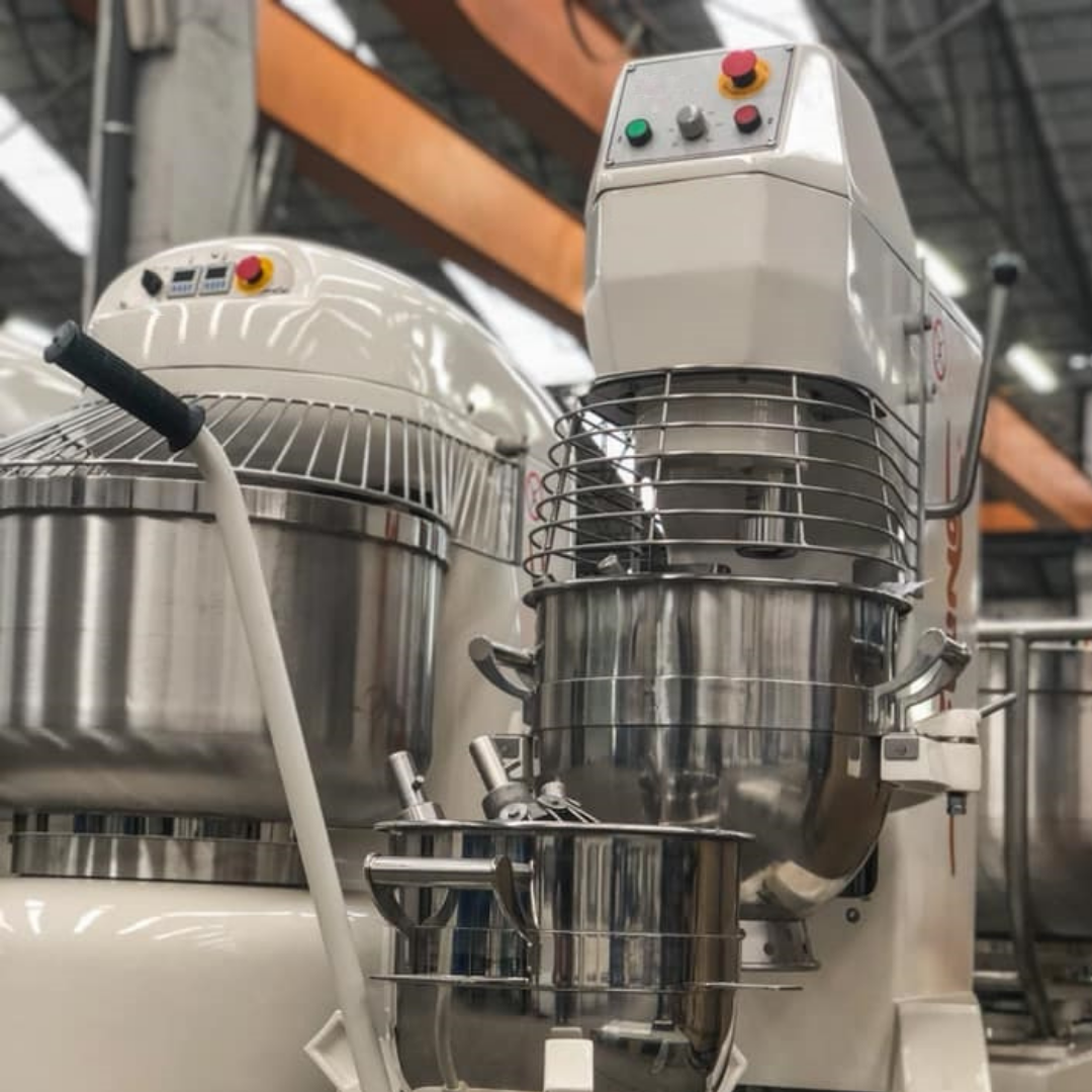 Row of Caprea spiral mixers loaded with dough inside a bakery